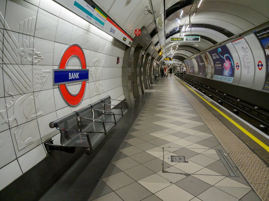 Interior view of the West Hampstead Thameslink underground station platform showing clean, tiled walls adorned with embossed decorative patterns and the London Underground 'Bank' station sign. The pla